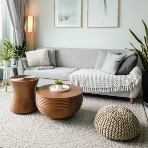 a living room filled with furniture and a large window